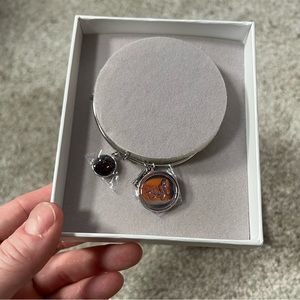 The Younique Foundation silver tone adjustable bracelet NIB